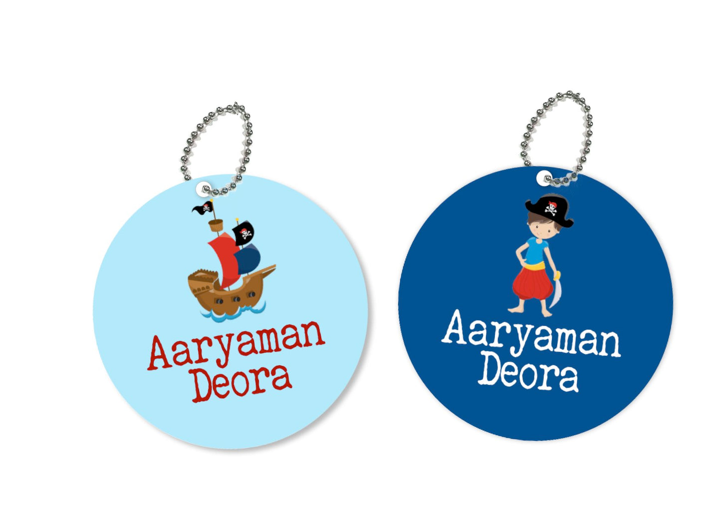 Two round metal bag tags with a pirate theme, one tag has 'Aryaman' written on it and the other has 'Deora' written on it, both with a cartoonish pirate character illustration in the center.
