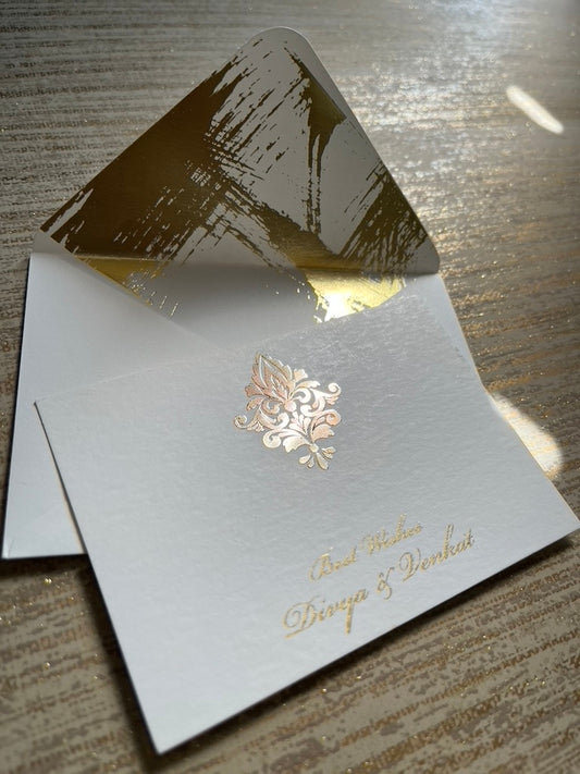 Cream paper with gold motif on a personalised gift card with an envelope to match