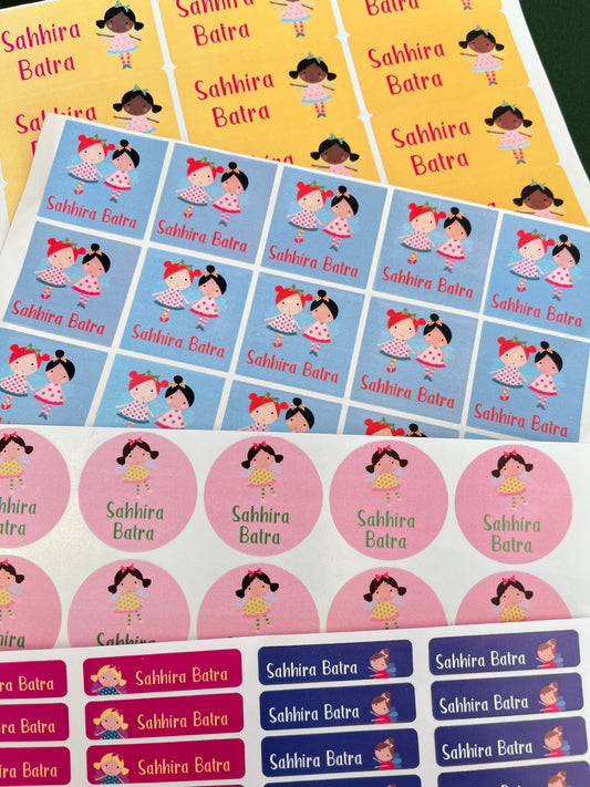 A sheet of colorful round stickers and rectangular labels featuring cartoon girl illustrations in multiple colorways, arranged on a white background.