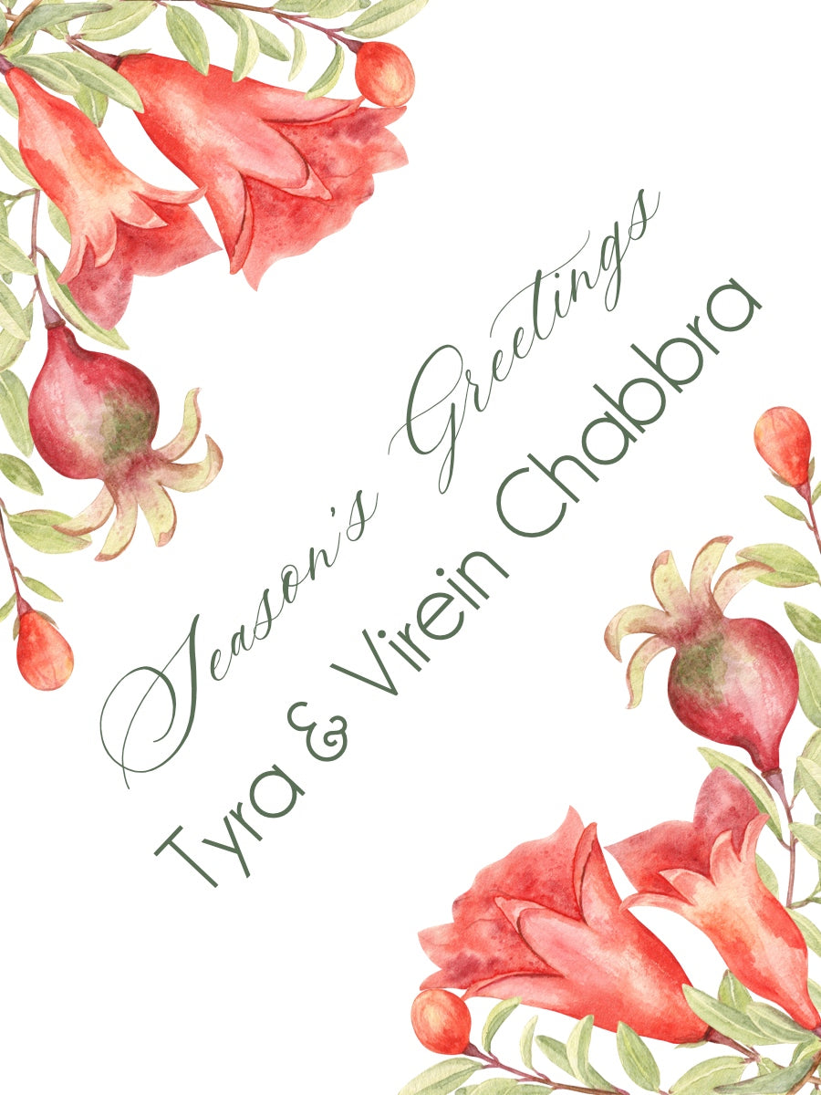 Floral design with pomegranates and their flowers with 'Season's Greetings' text on a white background