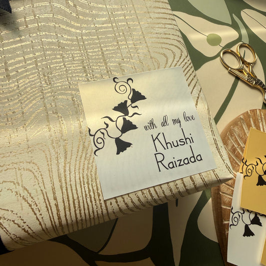 gift label on metallic paper with black lettering