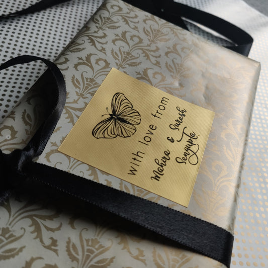 Butterfly gift label on gold paper