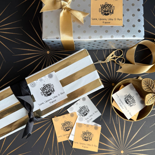 Gift boxes with ribbons and decorative tags on a patterned background