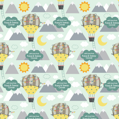 A patterned personalised wrapping paper with an airborne theme, featuring a hot air balloon, mountains, and sun.