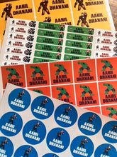 Collection of waterproof avengers themed branded stickers and labels on a wooden surface.