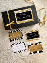 A set of 4 cards in striking black , white and gold abstract designs and cursive writing