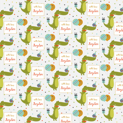 Personalised wrapping paper with a pattern of green crocodiles, blue and pink birds, and personalized text labels.