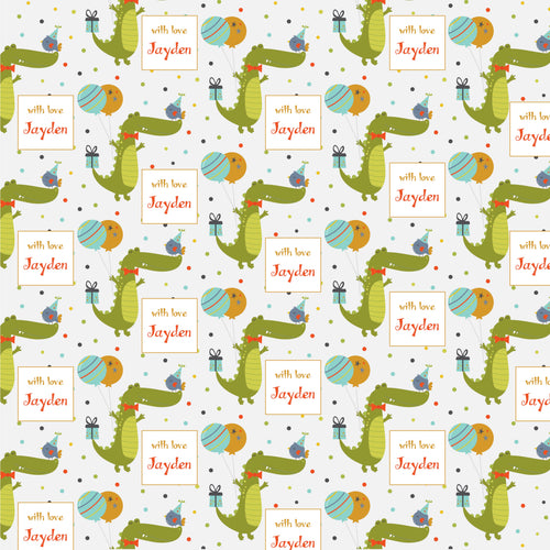 Personalised wrapping paper with a pattern of green crocodiles, blue and pink birds, and personalized text labels.