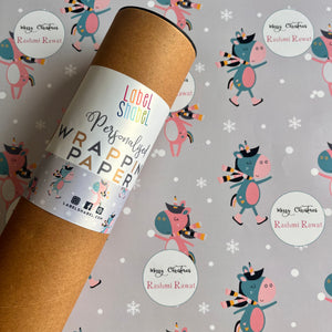 A roll of personalized wrapping paper with a dancing unicorn motif, placed on a background with various designs including snowflakes and cute creatures.