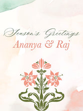 Season's Greetings card with floral design and 'Ananya & Raj' text on a watercolor background.