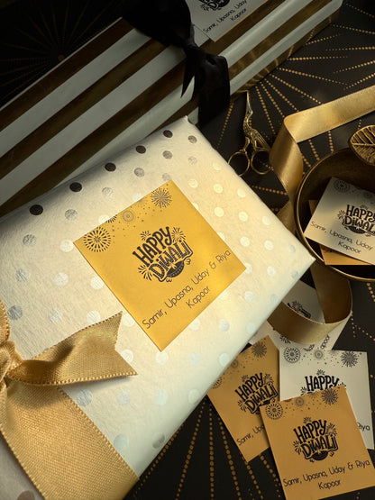 Gift box with polka dot pattern, gold ribbon, and 'Happy Hanukkah' card.
