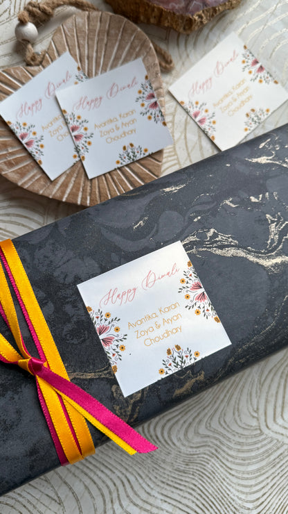 Gift box with decorative cards on a textured surface