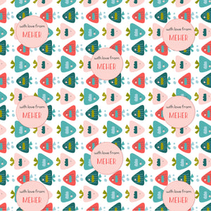 A patterned personalised wrapping paper with a variety of fish shapes in pink, blue, and green colors, and text that reads 'With love from MEHR'.