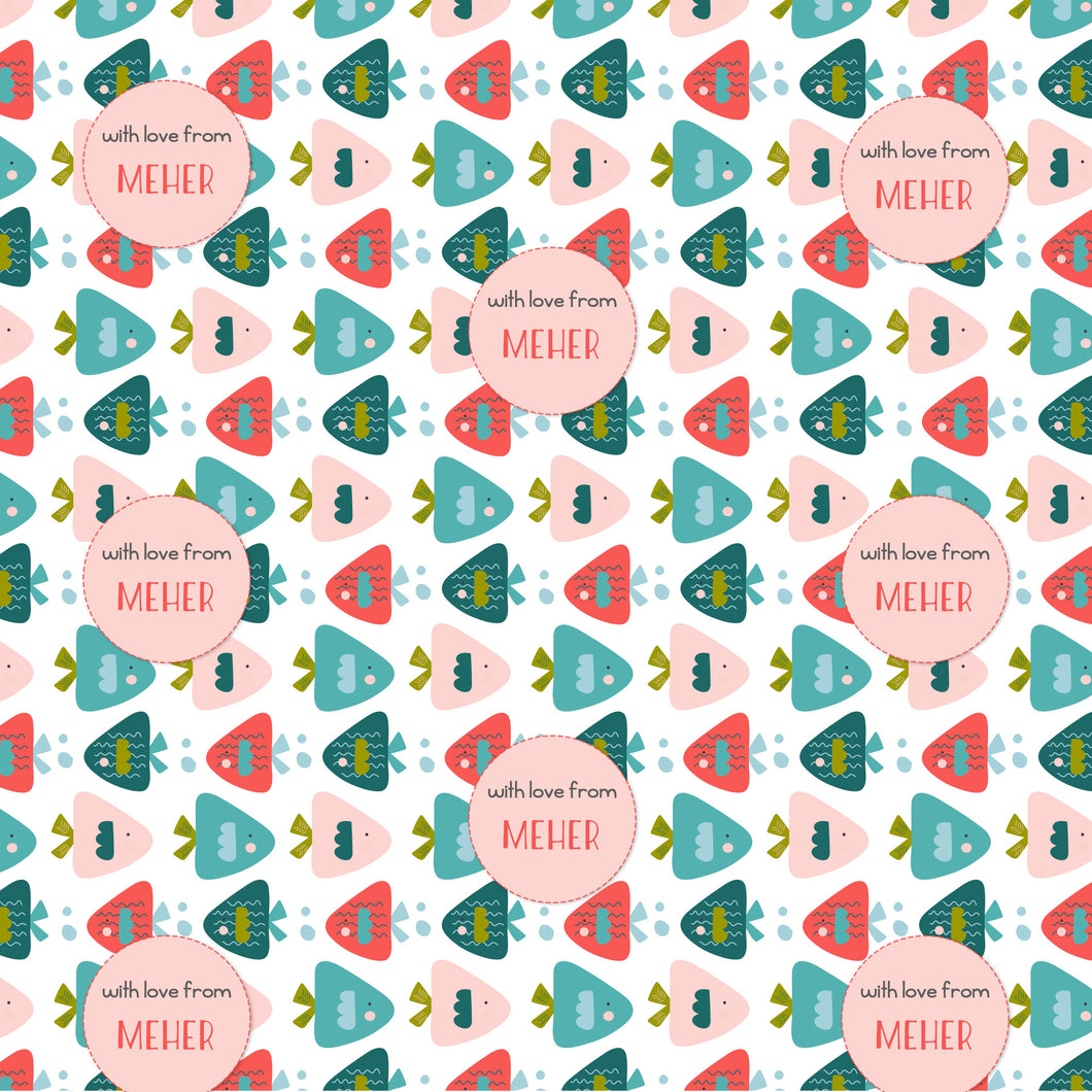 A patterned personalised wrapping paper with a variety of fish shapes in pink, blue, and green colors, and text that reads 'With love from MEHR'.