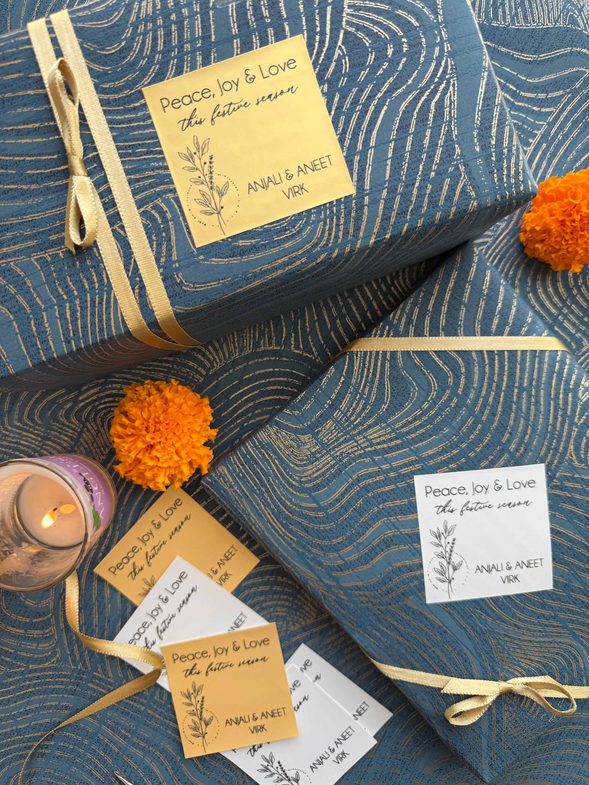 Blue textured fabric with golden ribbons and decorative elements on a matching background