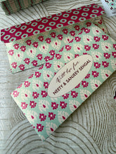ikat Floral patterned money envelope with personalisation on a textured surface
