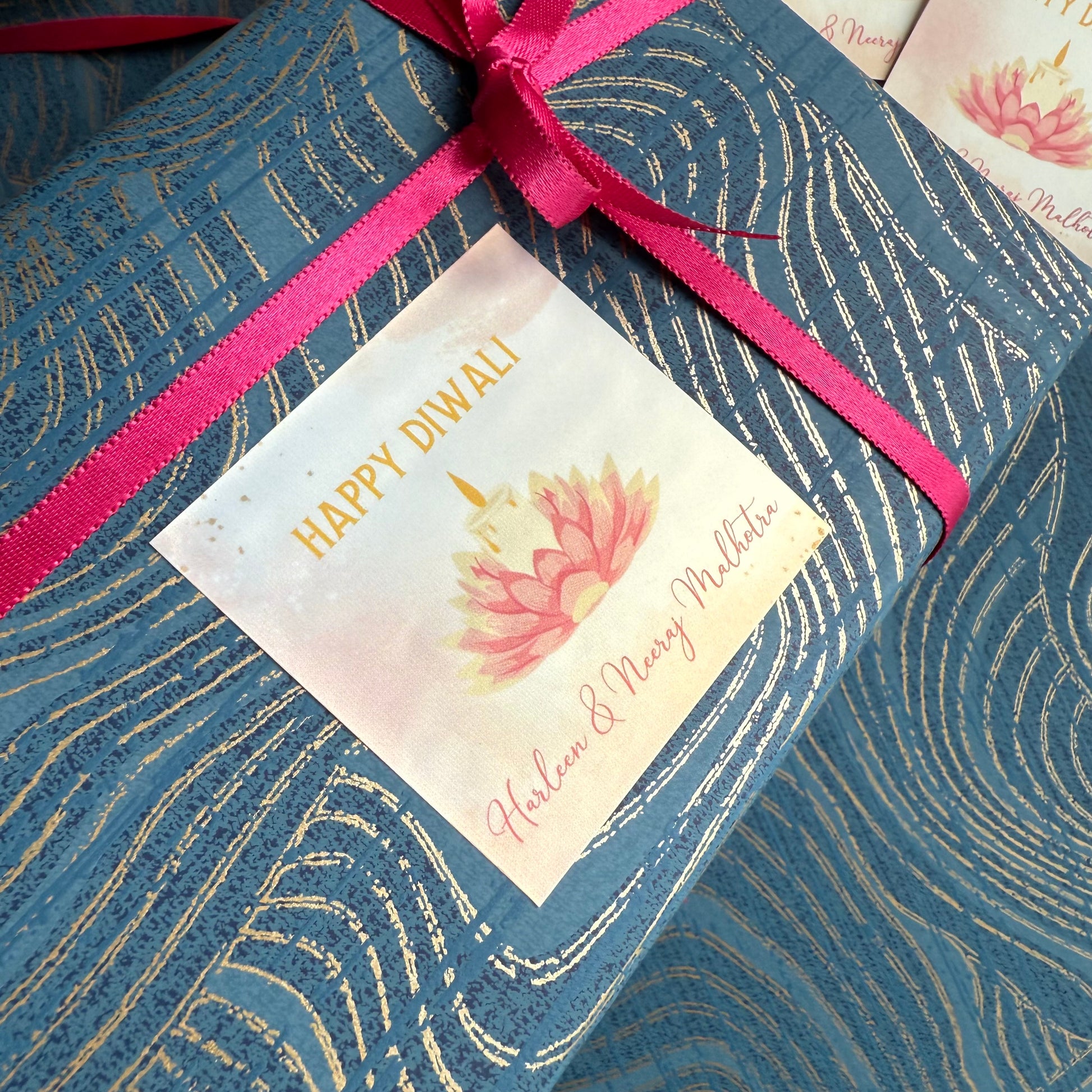 Gift box with 'Happy Diwali' tag and pink ribbon