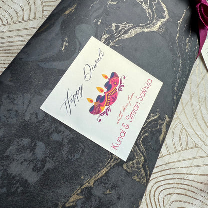 Greeting card with 'Happy Diwali' design on a decorative surface