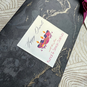 Greeting card with 'Happy Diwali' design on a decorative surface