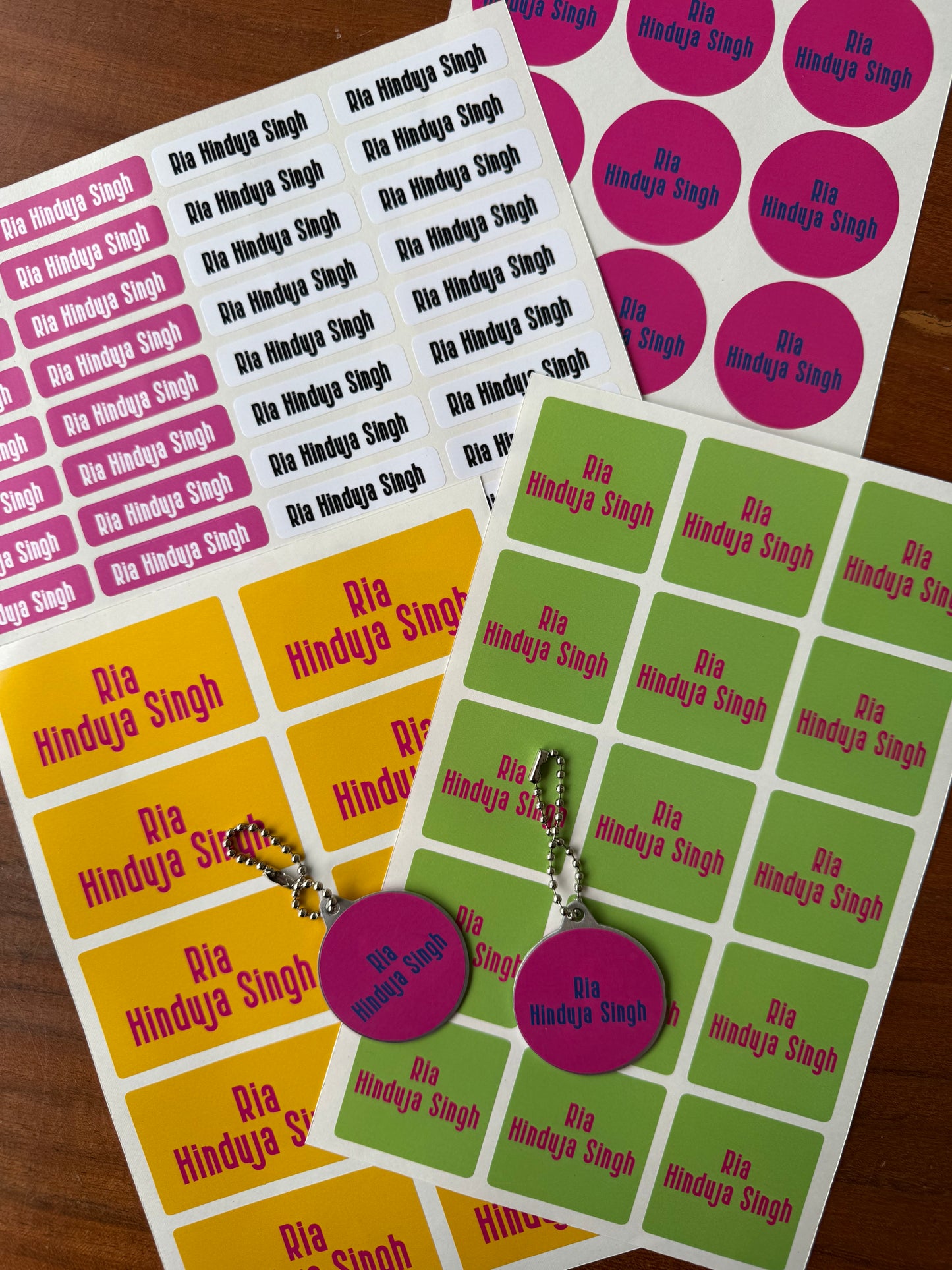 waterproof name stickers in bright bold pink, mango yello, green colours for school kids