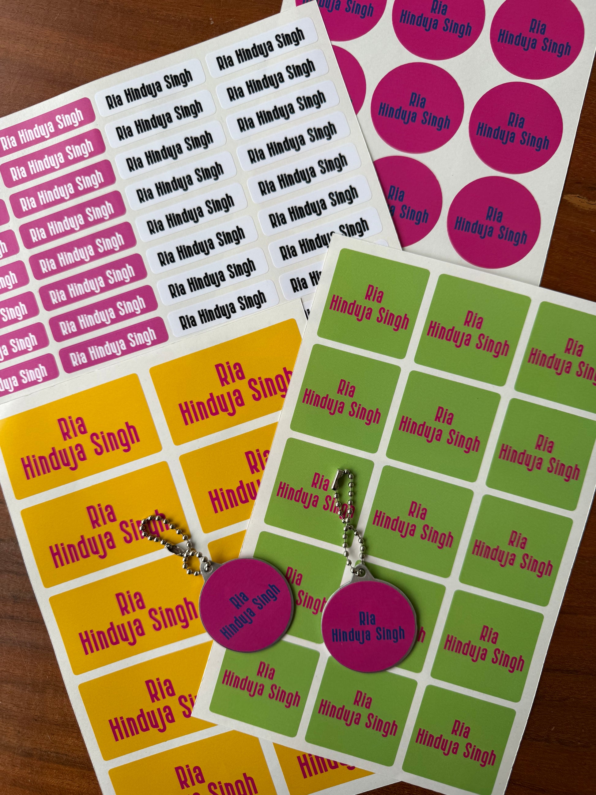 waterproof name stickers in bright bold pink, mango yello, green colours for school kids