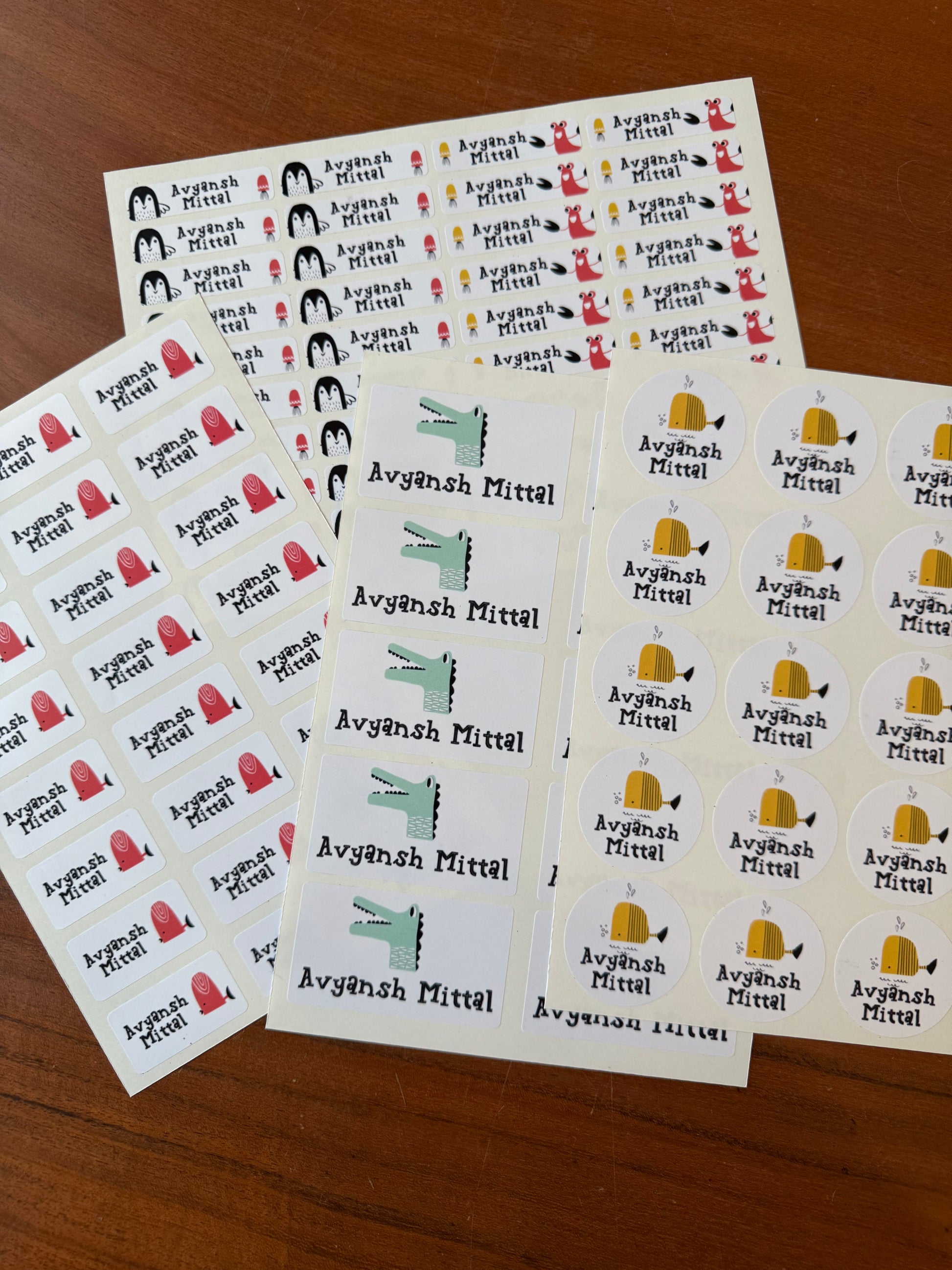 waterproof name stickers for school featuring cute ocean animals fish pencguin lobster on white background with colourful names