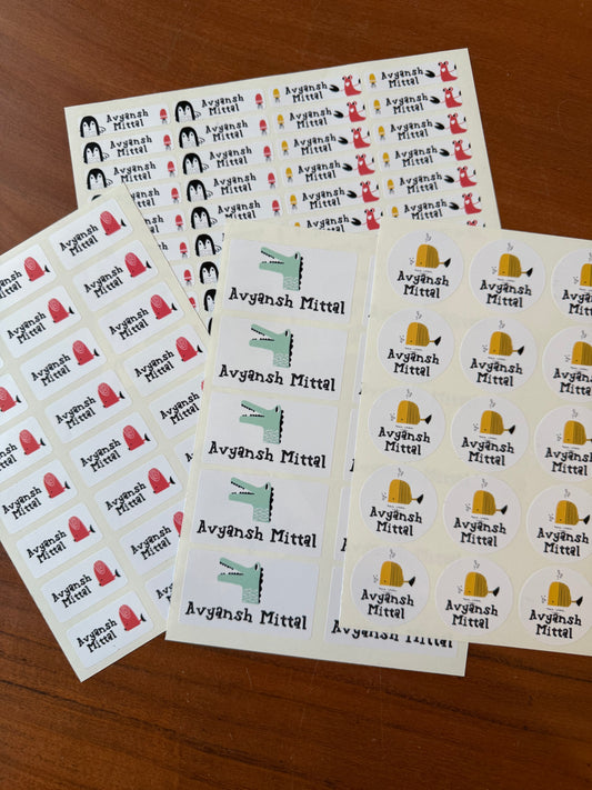 waterproof name stickers for school featuring cute ocean animals fish pencguin lobster on white background with colourful names