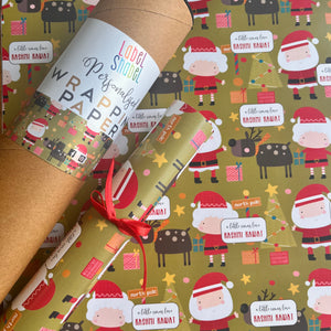 Wrapping paper featuring mr and mrs santa claus with a roll of paper