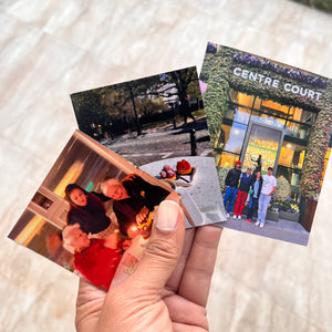 A collection of various photo magnets arranged different images including portraits and scenic shots.