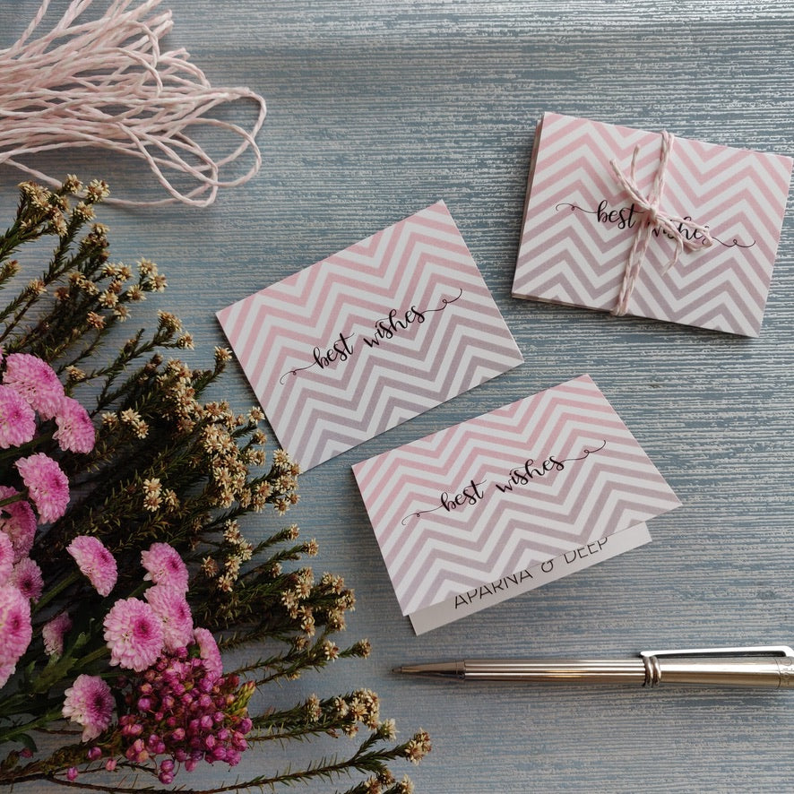folded gift tags pink and grey chevron design with name personalised inside on silver blue background with pink daisy flowers on left side