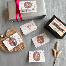 Folded gift card personalised with a name featuring a cute girl on an oval grey background surrounded by polka dots 
