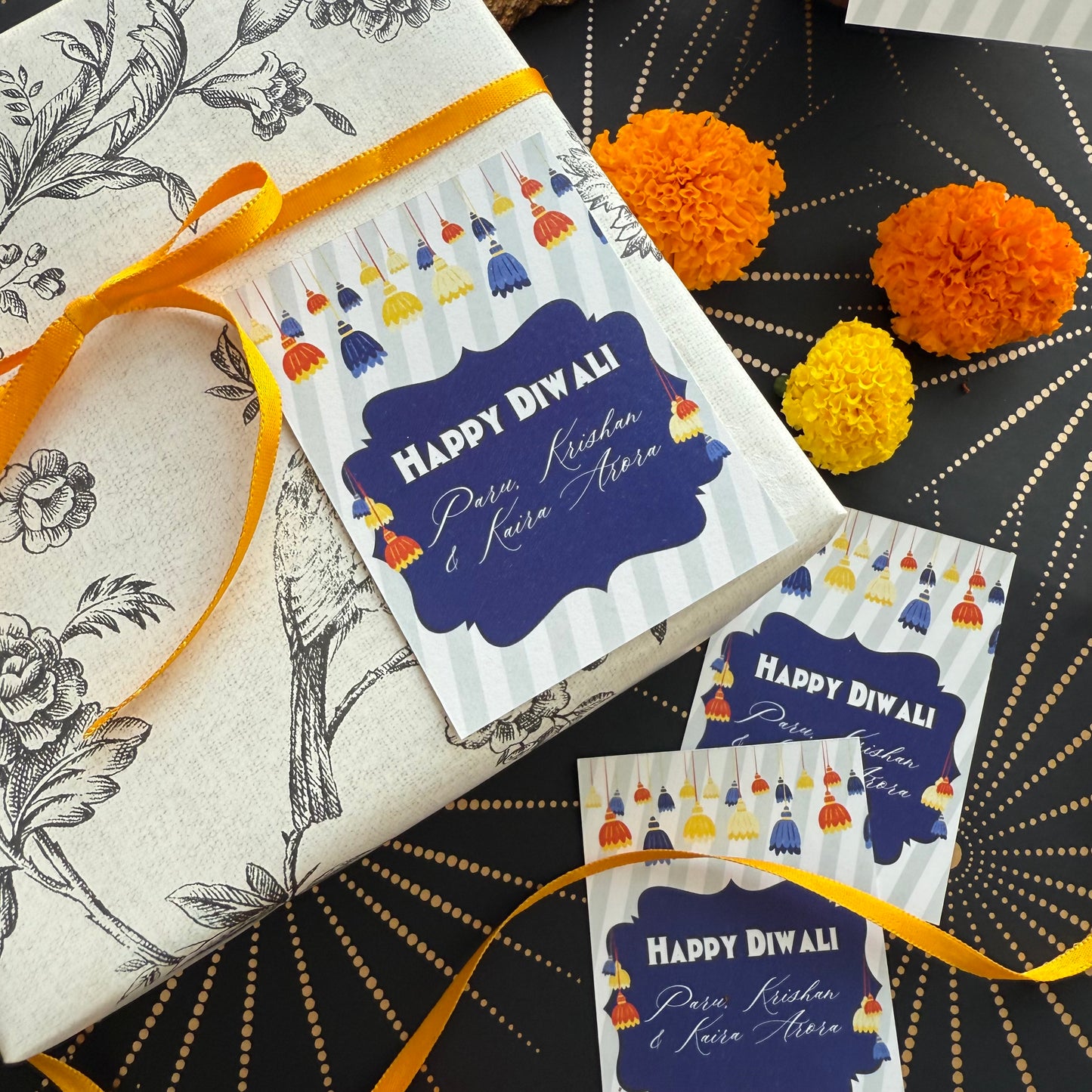 Packaged gift with 'Happy Diwali' card on a decorative background