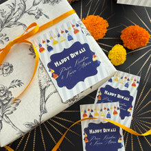 Packaged gift with 'Happy Diwali' card on a decorative background