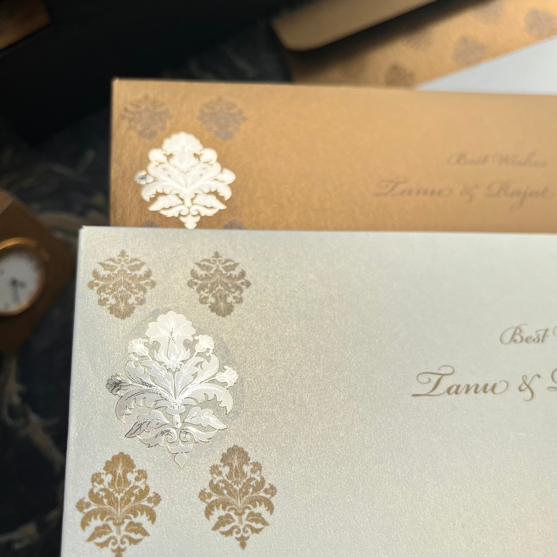Decorative Shagun envelopes with gold and silver embossed design.