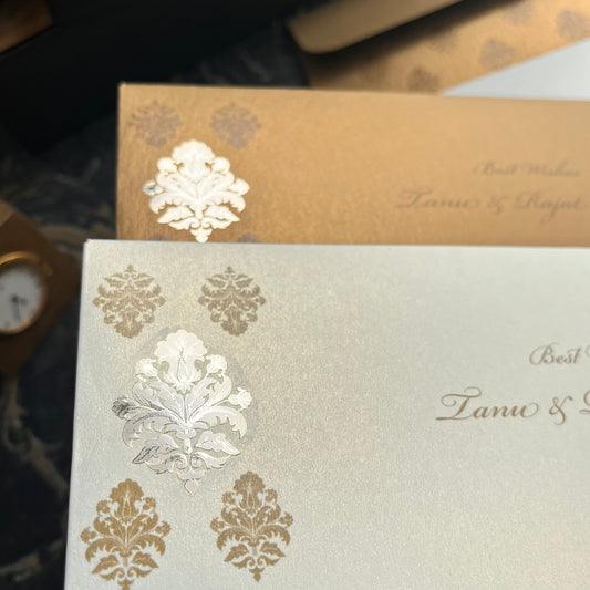 Decorative Shagun envelopes with gold and silver embossed design.