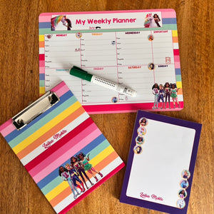 Colorful weekly planner, notepad, and clipboard with character illustrations on a wooden surface.