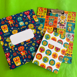 a set of robot themed pattern on a file folder, clipboard and diary