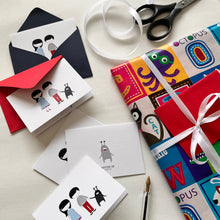 Gift card on white background and boy girl with pet animal with matching red and blue envelopes