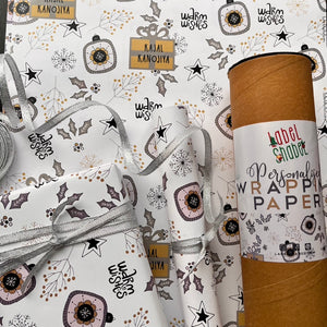 A white ang rey silver wapping paper with xmas holly leaves