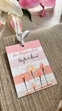 strioed gift tag with a ribbon