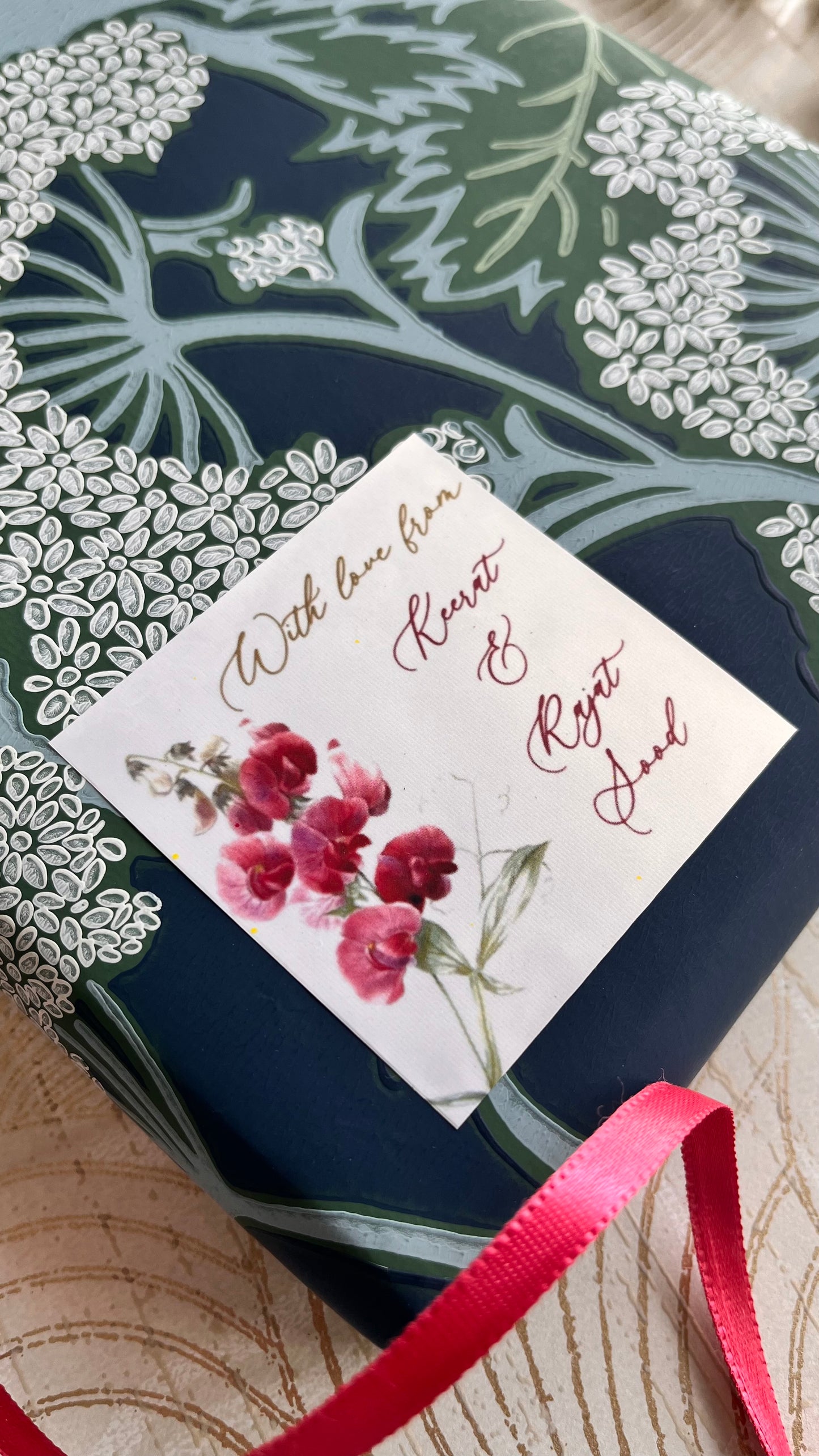 Close up image of glfit label with sweet pea flowers design and cursive fonts