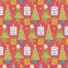 Personalised wrapping paper for christmas featuing xmas trees on a red background with an angel on top of the tree