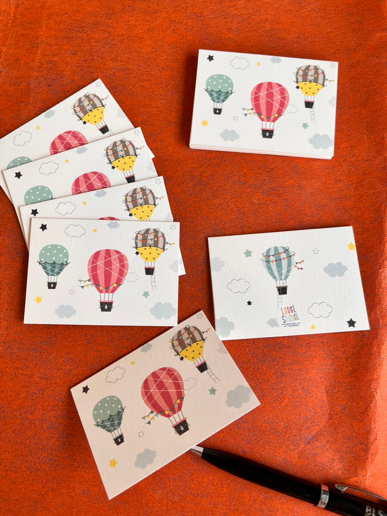 3 colourful air balloons on a folded gift tag with since balloon on the back and name personalisation inside