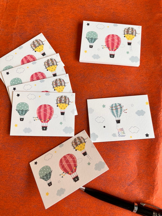 3 colourful air balloons on a folded gift tag with since balloon on the back and name personalisation inside