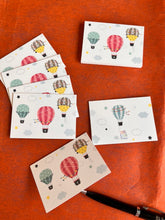3 colourful air balloons on a folded gift tag with since balloon on the back and name personalisation inside
