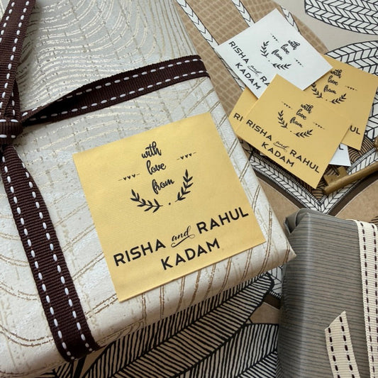 gold paper gift label with black text