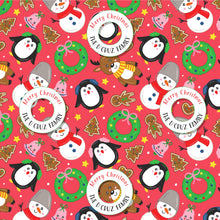bright red  xmas theme wrapping paper featuring a penguin, ginger bread cookie, wreaths and bells on a red background