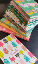 Stack of note books in  11 differnt prints