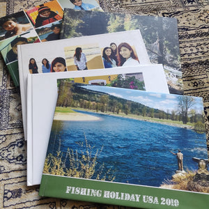 stack of photo coffee table books