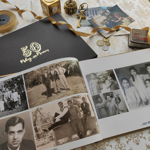  a printed photo book featuring old black and white photos of young people with some colour photographs in the background